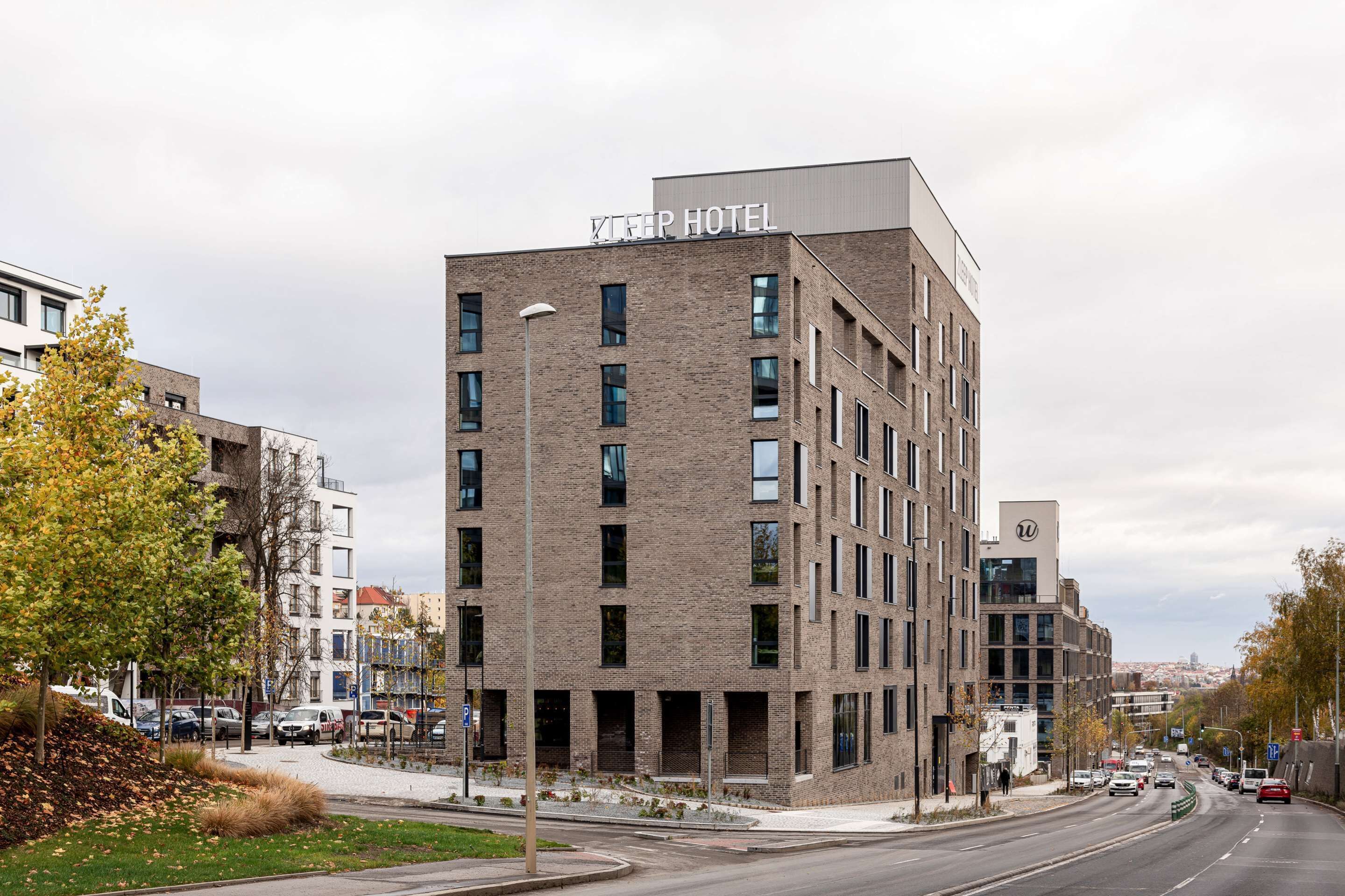 A modern hotel building with a sign reading "KIPPER HOTEL" on the top.