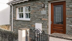 A stone building with a sign reading "Castle Crag." - Castle Crag (Keswick)