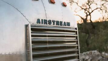 A trailer with the brand name "AIRSTREAM" on its side.