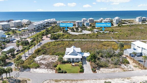 A coastal residential area with beach access and a community pool.