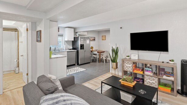 A modern apartment with a living room, dining area, and kitchen. - 8/19 now available Updated 2br Minutes from downtown- backyard & Firepits

 (Colorado Springs)
