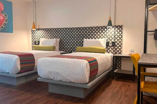 Family Studio Suite | Minibar, in-room safe, individually decorated, individually furnished