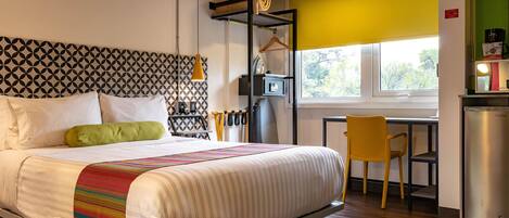 Suite, 1 Queen Bed, Non Smoking | Minibar, in-room safe, individually decorated, individually furnished