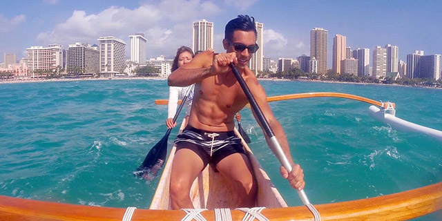 Riding the waves of Waikiki in an Outrigger Canoe
