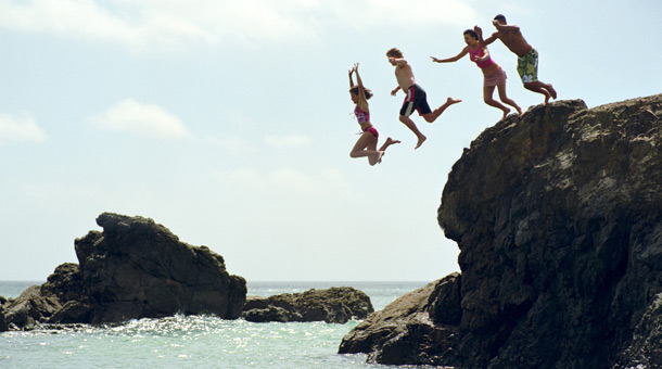 people jumping into the water