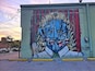 Part of Deep Ellum's street art project. This guy is split on a #red background. Cubism feels.