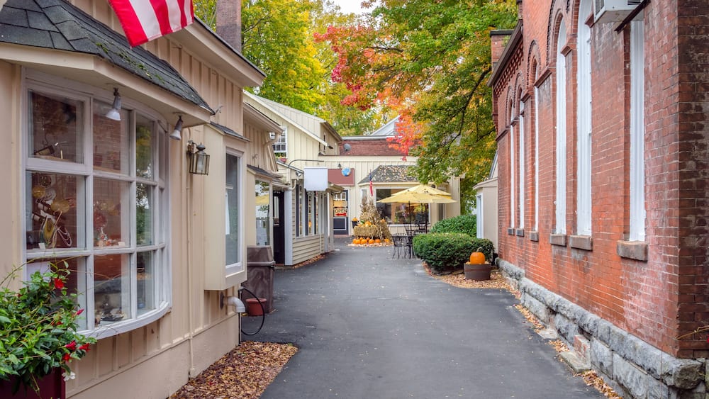 Deserted Alley Lined with Traditional Shops Decorated for Halloween