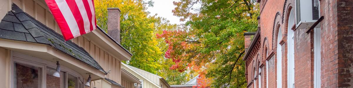 Deserted Alley Lined with Traditional Shops Decorated for Halloween