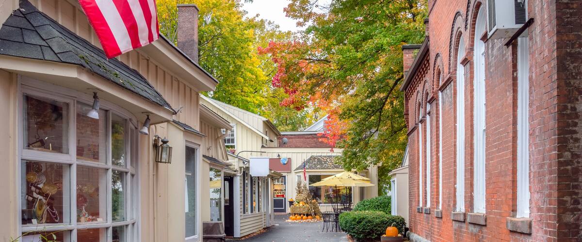Deserted Alley Lined with Traditional Shops Decorated for Halloween