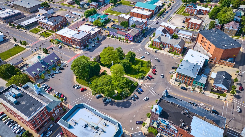 Aerial small town Mount Vernon with green park in center and buildings surrounding