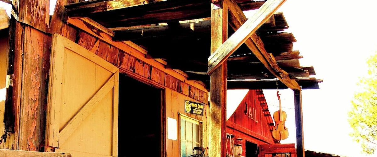 A rustic wooden building with a sign that reads "GENEVA."