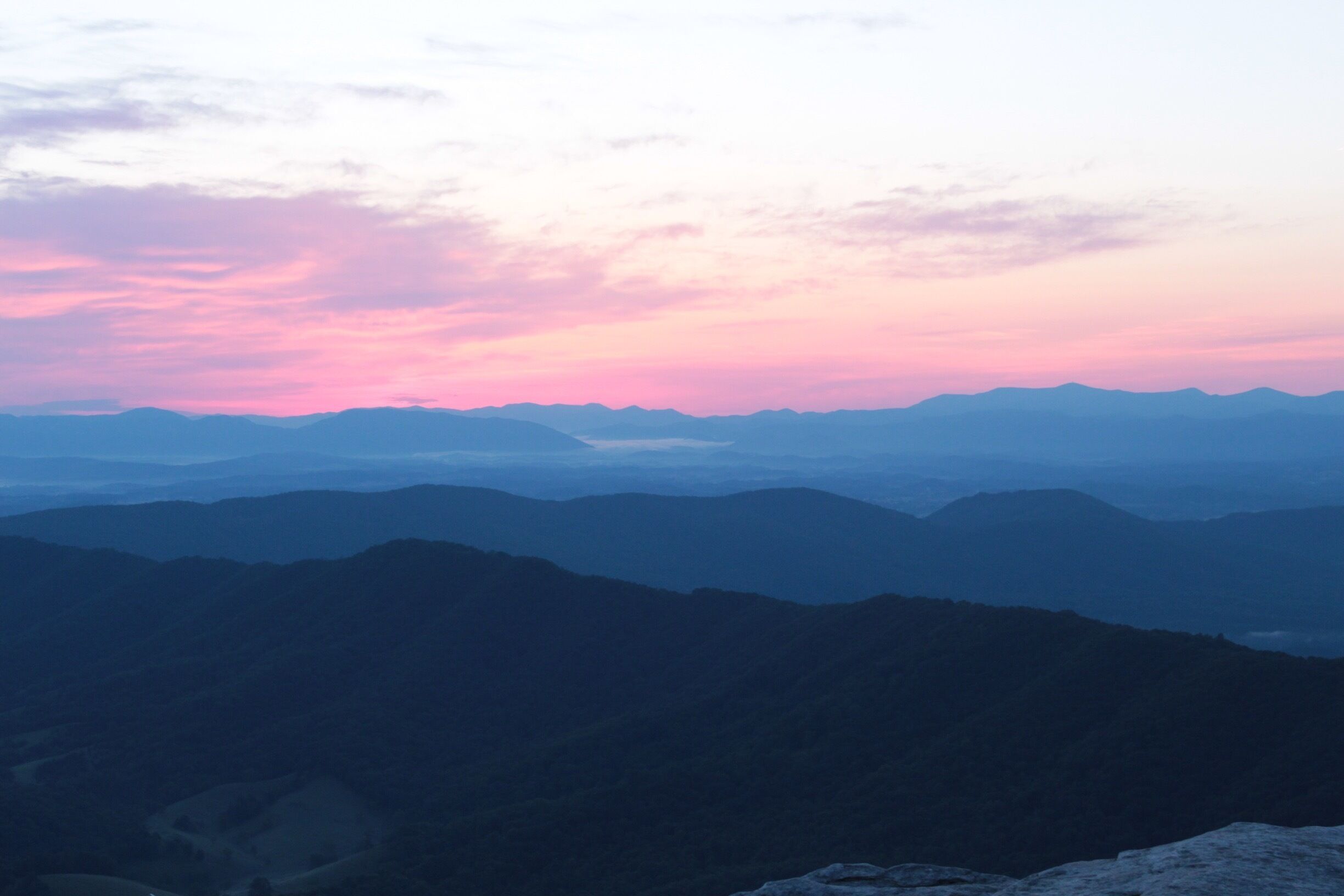 This photo was taken at sunrise looking out on top of McAfee Knob in VA. One of my favorite hikes I did while in Virginia. 