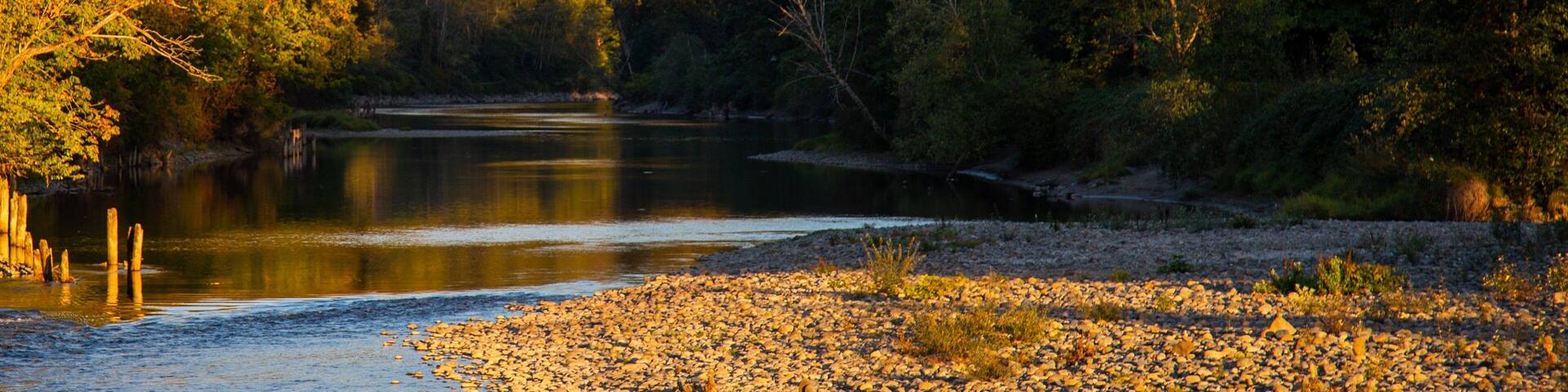 Snoqualmie showing a river or creek, a sunset and forest scenes