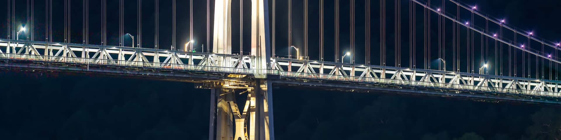 Night photo of the support tower of the Mid-Hudson suspension bridge located near Poughkeepsie, New York