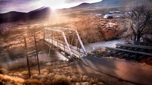 Bridge over the Truckee River at sunrise, Fernley, NV. Sun breaking over mountains.
