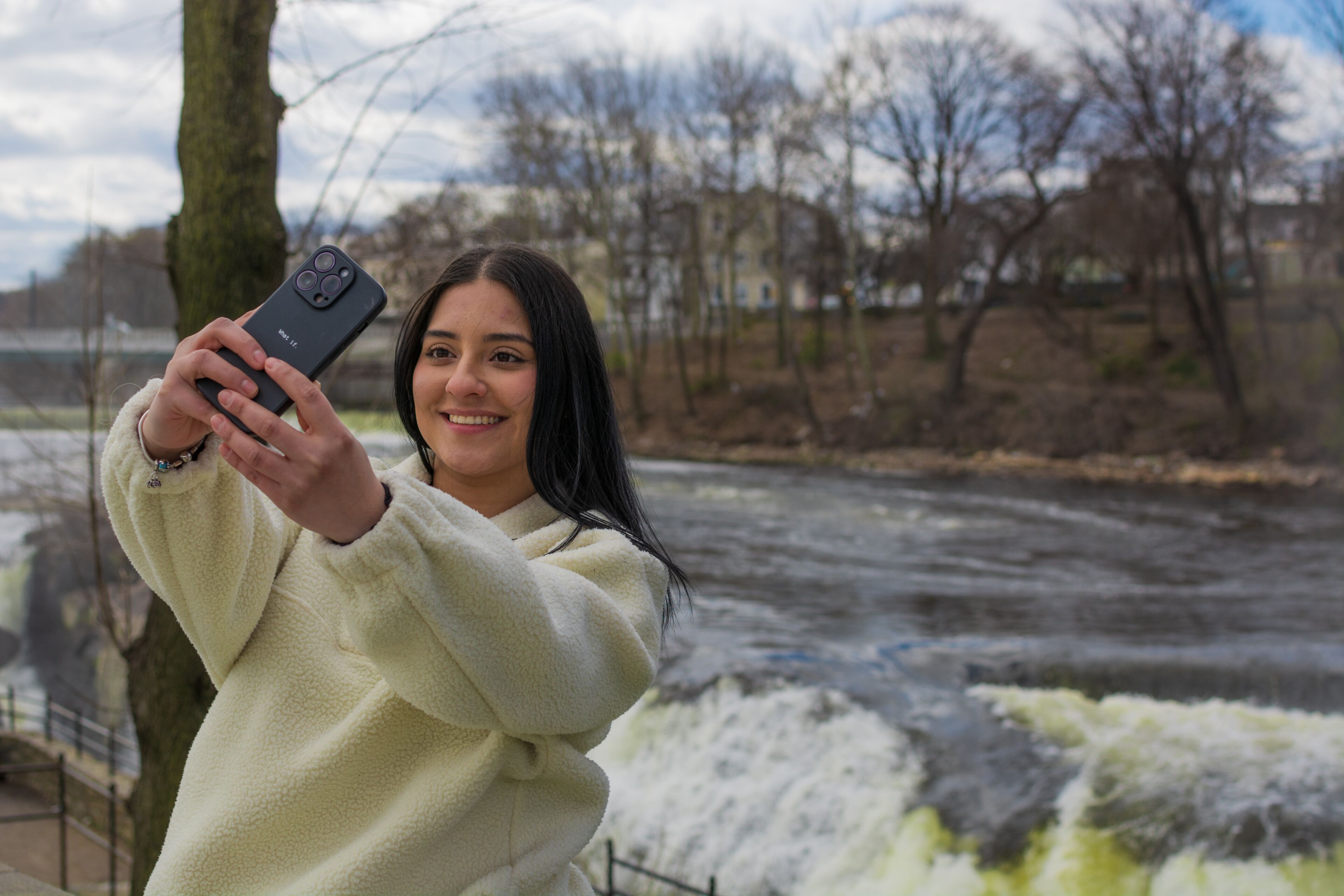 Hispanic woman taking selfie near Paterson Great Falls
