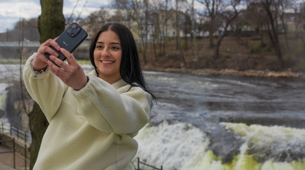 Hispanic woman taking selfie near Paterson Great Falls