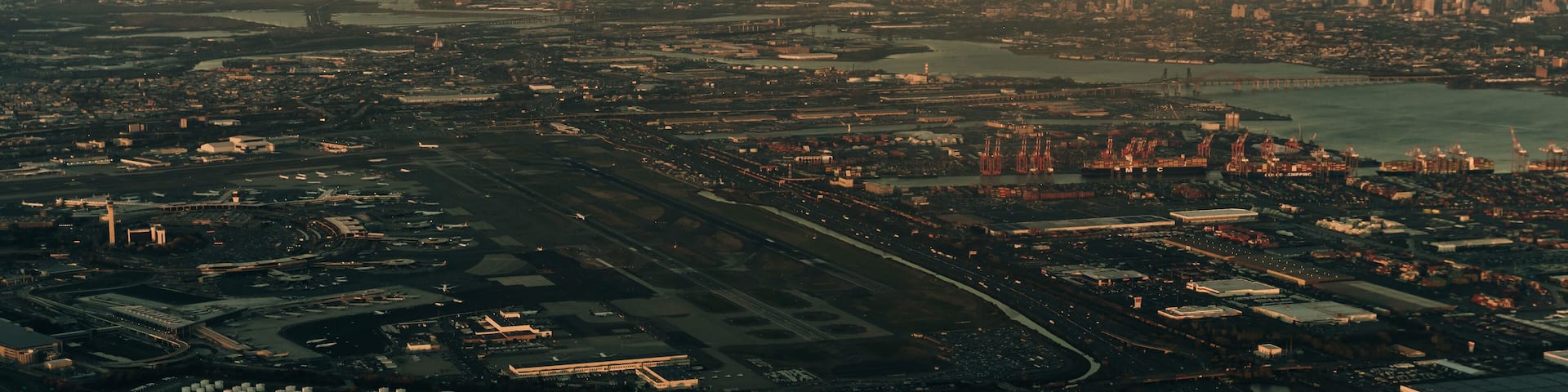 view of new york and new jersey from the plane on sunset