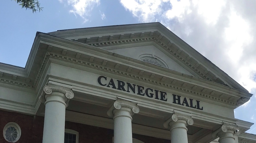 Tuskegee University, one of the largest historically black universities in the United States, is a private university located in Tuskegee, Alabama. It was founded by Lewis Adams, a former slave, and George W. Campbell, a former slave owner. Adams asked that an educational institution for blacks be established. After Foster won the election, $2,000 (per year) was allocated from the state general budget for such a school to be located in Macon County. It was officially founded on July 4th, 1881, with Booker T. Washington, then a 25-year-old teacher at Hampton Institute in Virginia, as its first principal, a position he maintained until his death in 1915. Tuskegee acquired university status in 1985. Today it offers undergraduate, masters, professional, and doctoral degrees to more than 3,000 students with a strong orientation toward the relationship between education and work force preparation in the sciences, professions and technical areas. It was the first black college to be designated as a Registered National Historic Landmark (1966), and is the only black college to be designated as a National Historic Site.