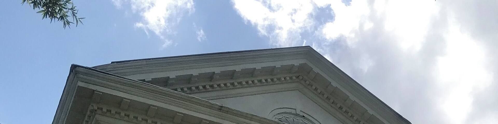 Tuskegee University, one of the largest historically black universities in the United States, is a private university located in Tuskegee, Alabama. It was founded by Lewis Adams, a former slave, and George W. Campbell, a former slave owner. Adams asked that an educational institution for blacks be established. After Foster won the election, $2,000 (per year) was allocated from the state general budget for such a school to be located in Macon County. It was officially founded on July 4th, 1881, with Booker T. Washington, then a 25-year-old teacher at Hampton Institute in Virginia, as its first principal, a position he maintained until his death in 1915. Tuskegee acquired university status in 1985. Today it offers undergraduate, masters, professional, and doctoral degrees to more than 3,000 students with a strong orientation toward the relationship between education and work force preparation in the sciences, professions and technical areas. It was the first black college to be designated as a Registered National Historic Landmark (1966), and is the only black college to be designated as a National Historic Site.