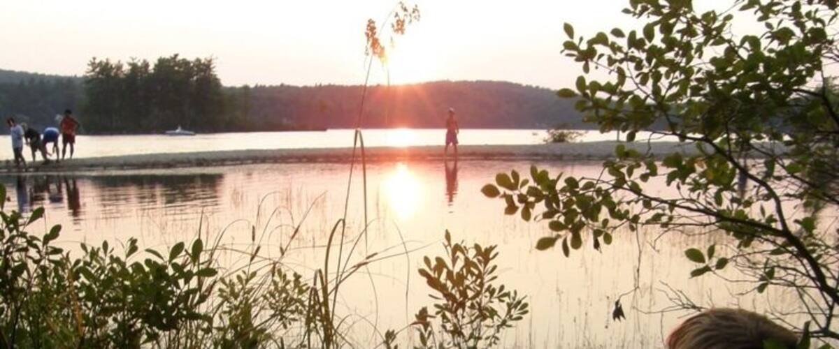 One of my favorite shots.  My son watching a group of local fishermen at sunset on Maine's Sebago Lake.