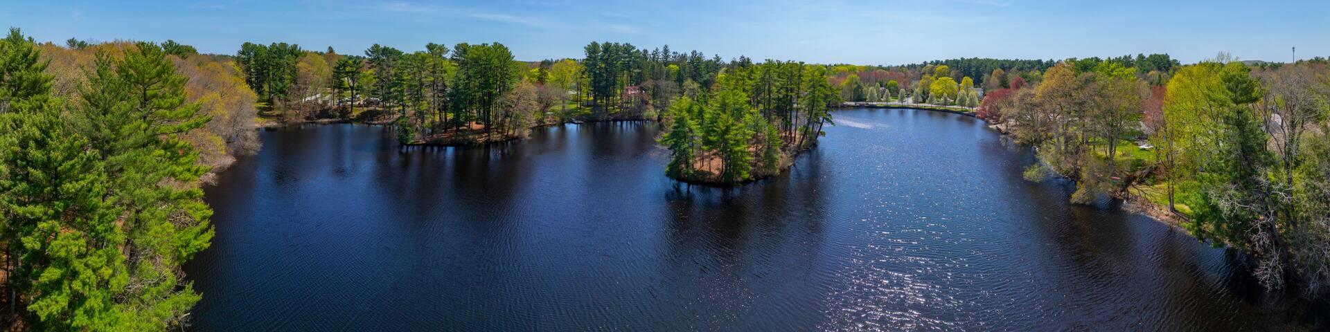 Johnson Pond aerial view on Forge River in spring at the historic center of Raynham, Bristol County, Massachusetts MA, USA.