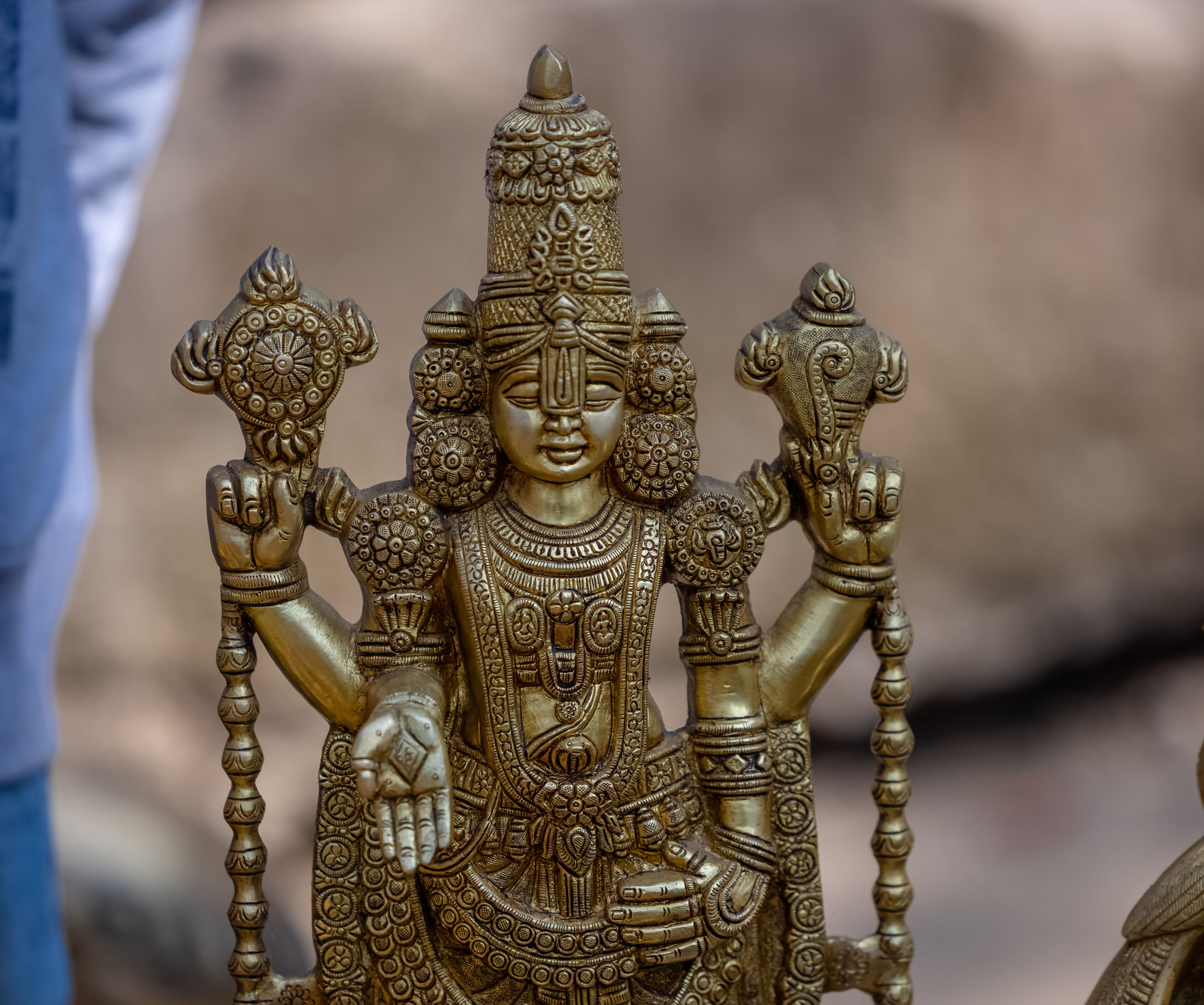 A handmade brass idol of Lord Tirupati Balaji is a stunning piece of art that blends craftsmanship with spiritual significance.