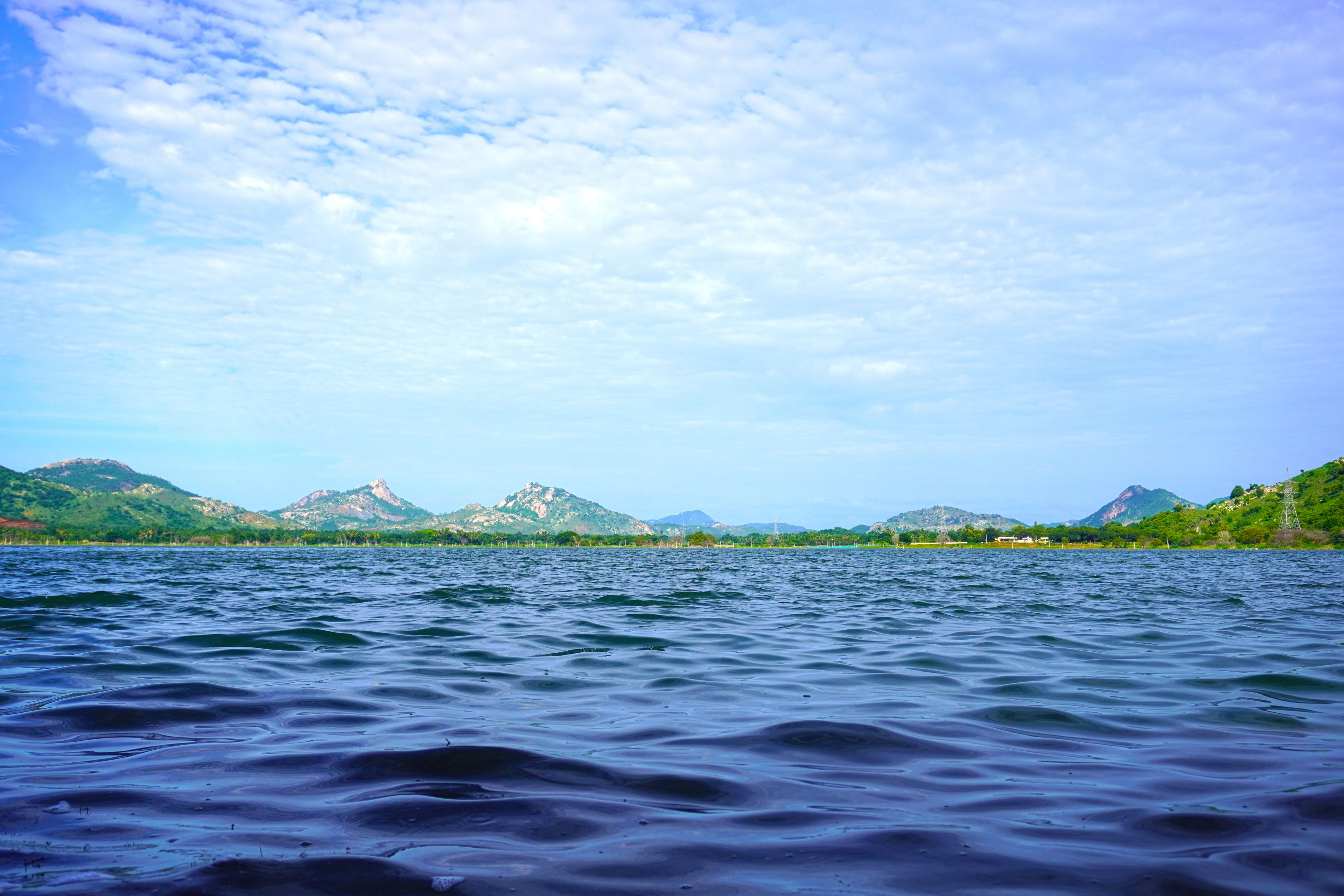 A lake with mountains in the background.