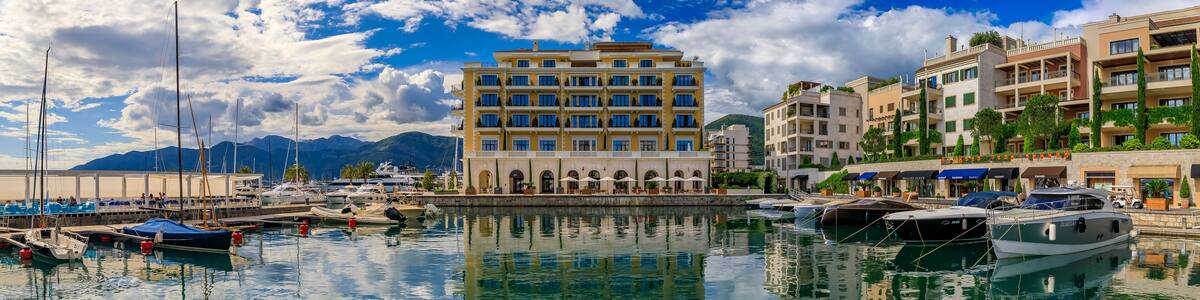 Tivat, Montenegro - May 31, 2019: Scenic view of the Adriatic Sea and modern residential buildings, luxury shops and boats in the summer
