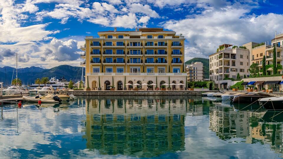 Tivat, Montenegro - May 31, 2019: Scenic view of the Adriatic Sea and modern residential buildings, luxury shops and boats in the summer