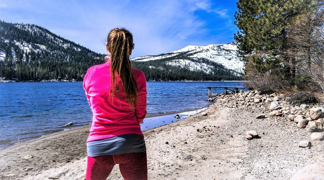 Donner Lake is a freshwater lake in Northeast California on the eastern slope of the Sierra Nevada and about 11 miles northwest of the much larger Lake Tahoe.