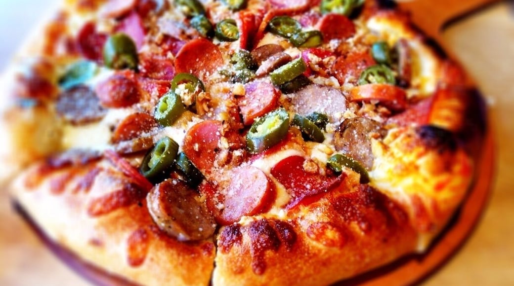andouille sausage, pepperoni, roasted garlic, jalapeno, olive pizza