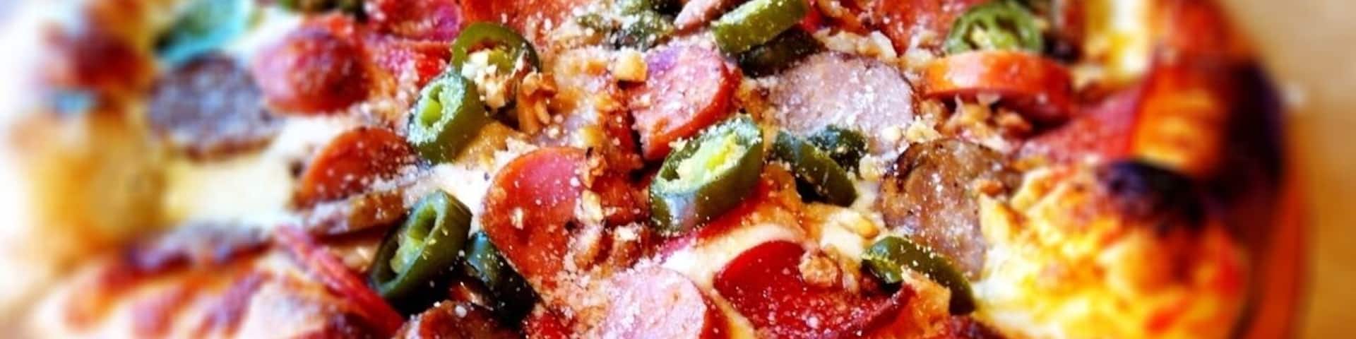 andouille sausage, pepperoni, roasted garlic, jalapeno, olive pizza