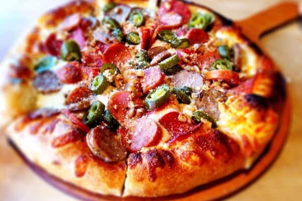 andouille sausage, pepperoni, roasted garlic, jalapeno, olive pizza
