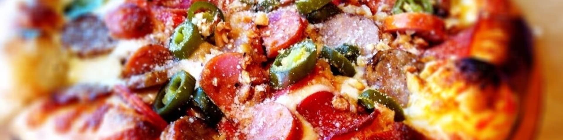 andouille sausage, pepperoni, roasted garlic, jalapeno, olive pizza