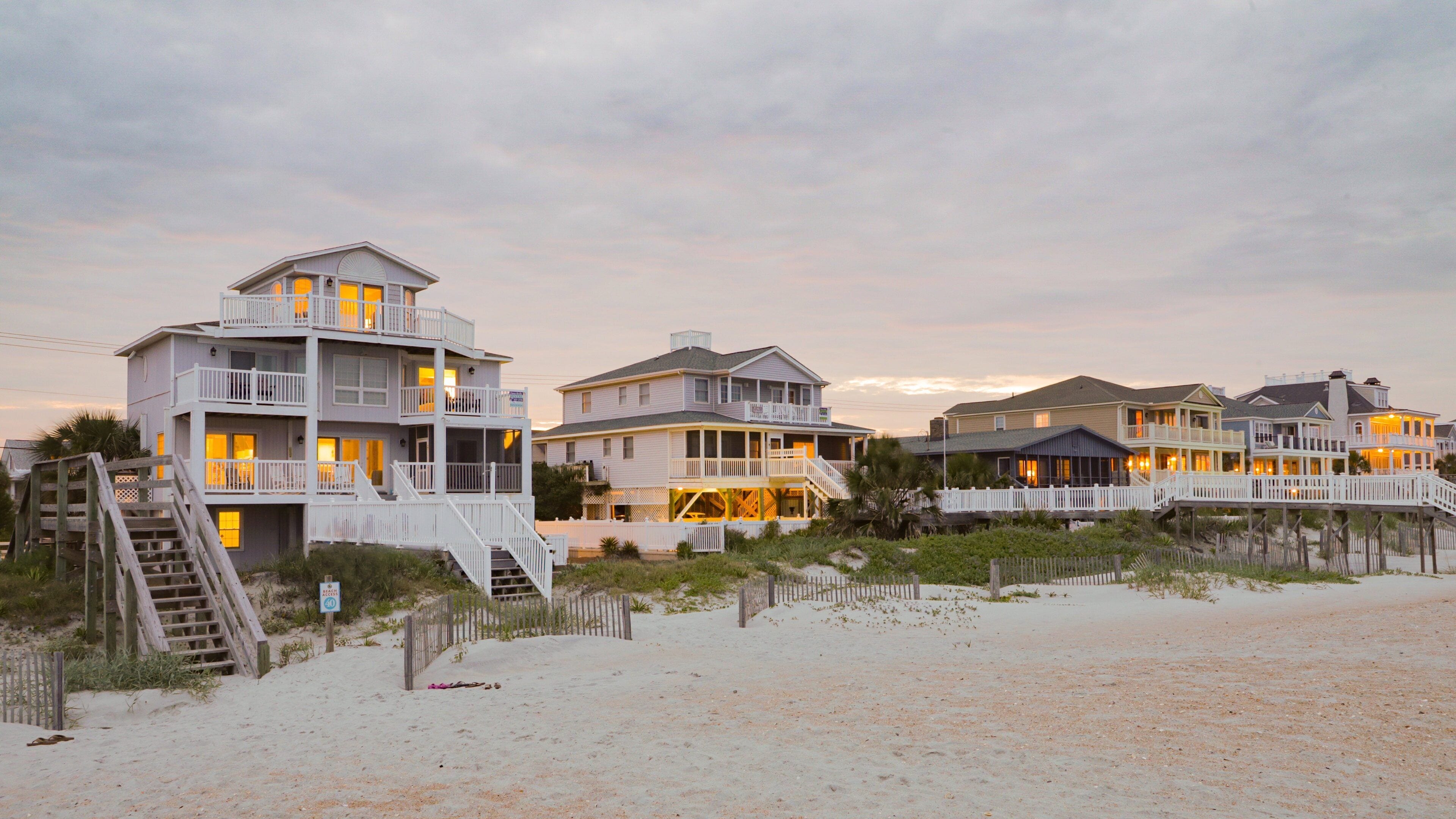 Murrells Inlet featuring a sunset, a coastal town and a beach