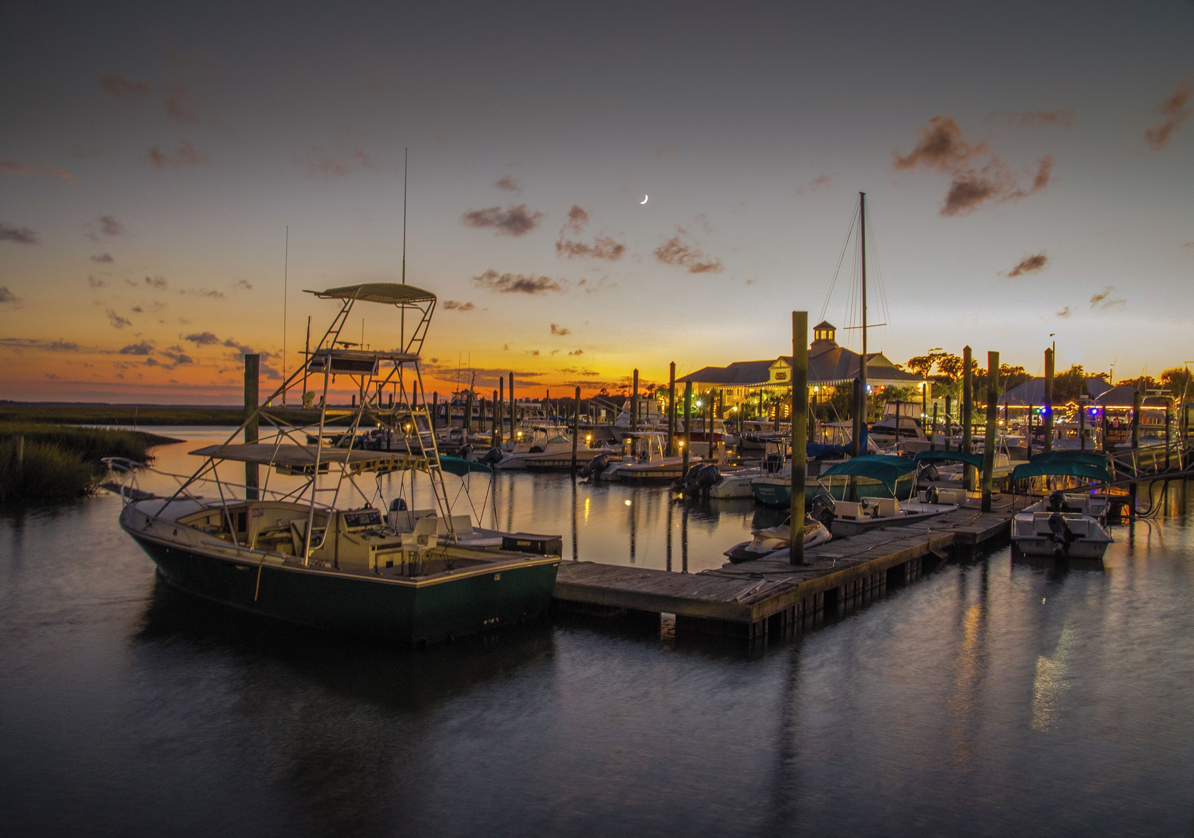"Boats are docked for the night at Captain Dicks Marina in Murrells Inlet, South Carolina"