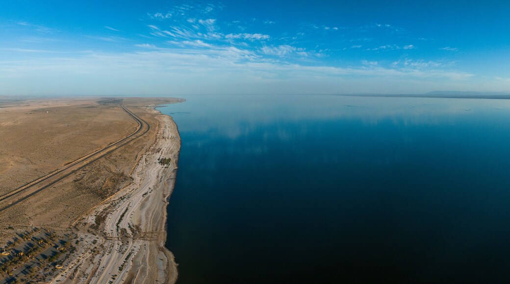 Aerial view over Salton sea in California. Huge lake in the middle of a desert at sunset.