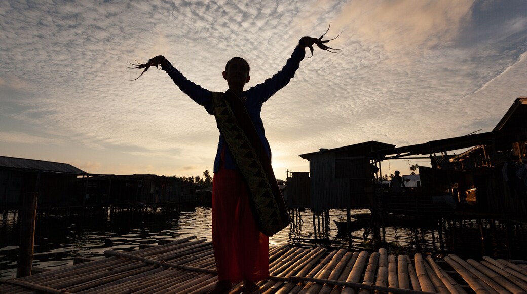 A dancer moves against the sunset during a traditional wedding of the Badjao people from Brgy. Tongehat, Sibuto Island, Tawi-tawi. Photos by Jojo Mamangun