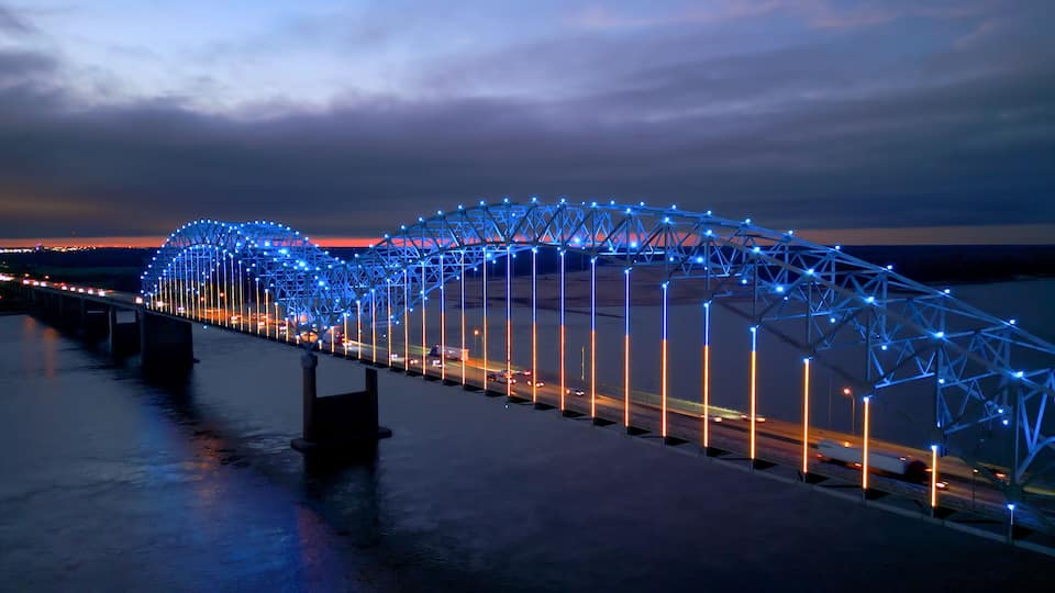 A bridge at twilight with blue lights.