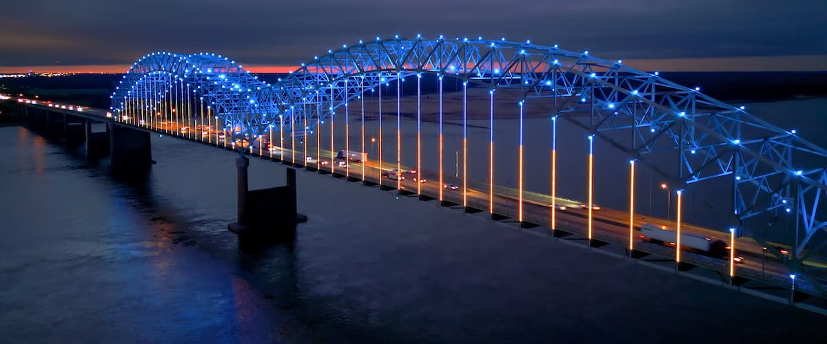A bridge at twilight with blue lights.