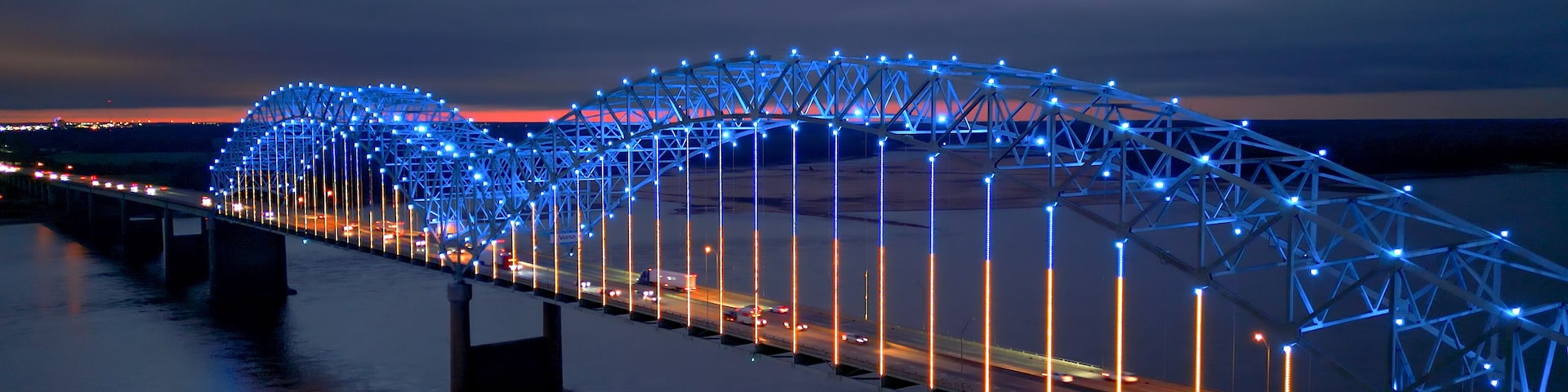 A bridge at twilight with blue lights.