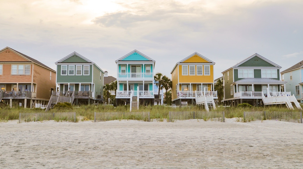 Surfside Beach showing a sunset, a coastal town and a sandy beach