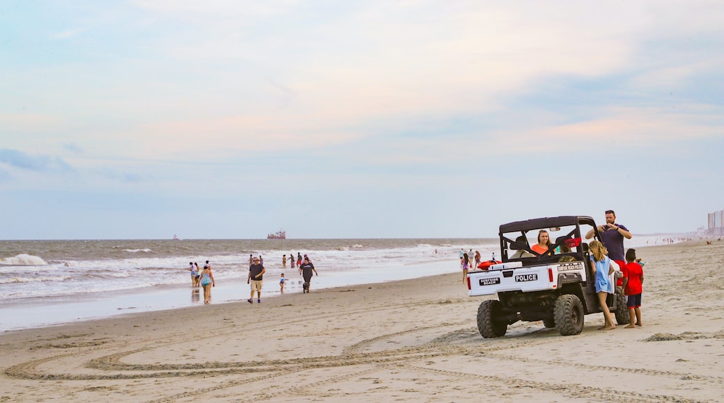 Surfside Beach showing a sandy beach, a sunset and general coastal views