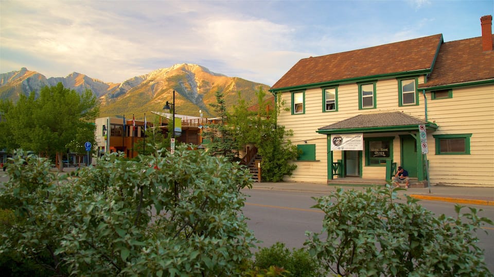 A mountain town with a diner named "Mine Side Diner" and a mountain backdrop.