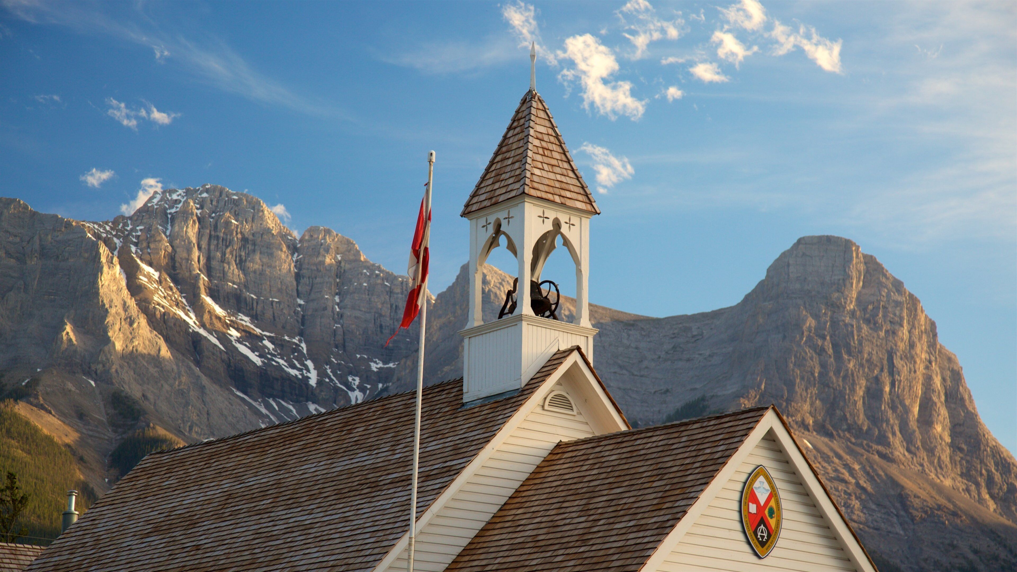 Canmore which includes mountains, a sunset and heritage elements
