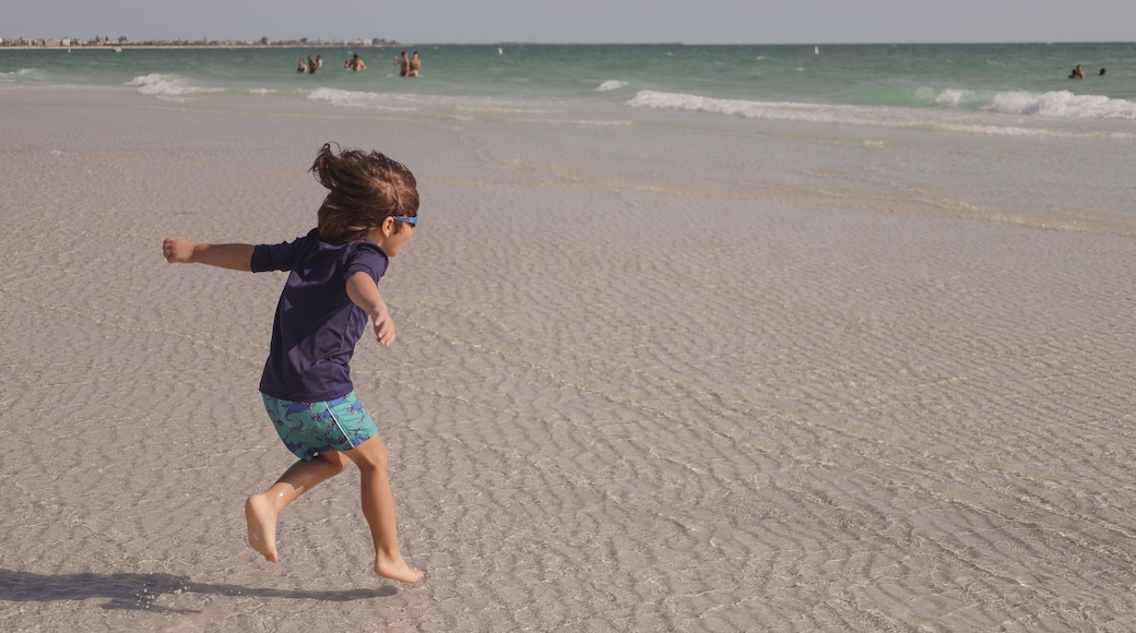 boy playing on Sunset Beach located at the southern tip of Treasure Island, Florida in Pinellas County.