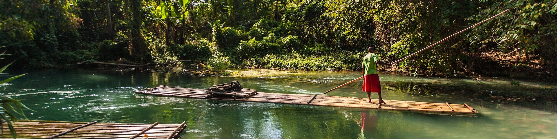 Captain Steering Bamboo Boat
