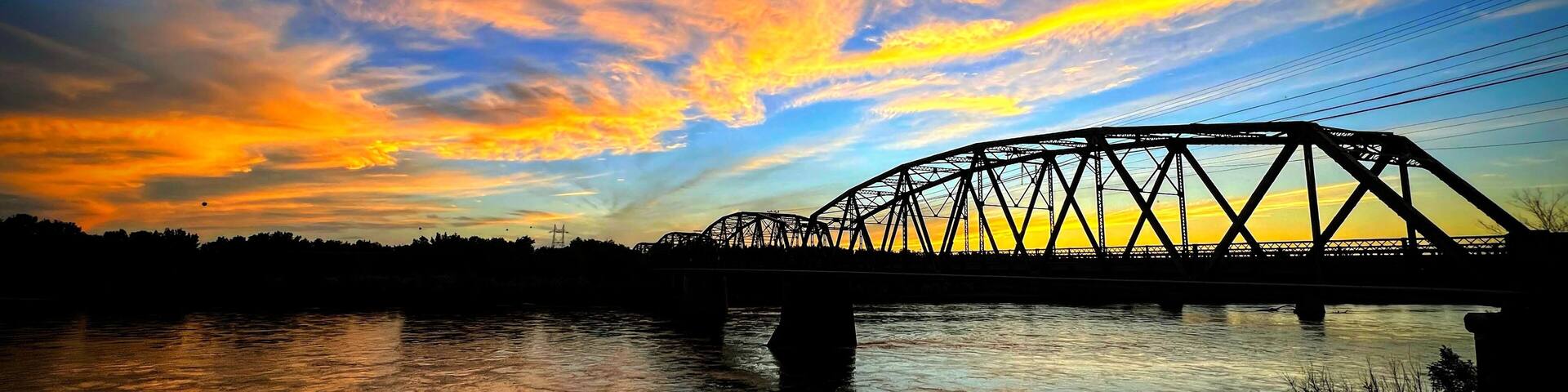 A Majestic Sunset over a Yellowstone River Bridge