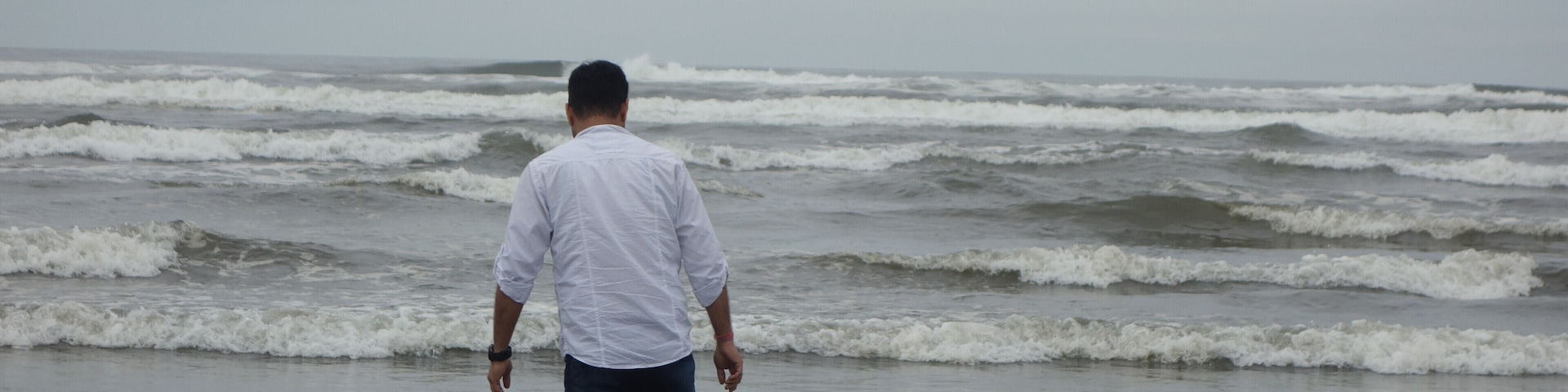 My Husband exploring how cold the water can be on a cloudy beach Day :)
#lifeatexpedia